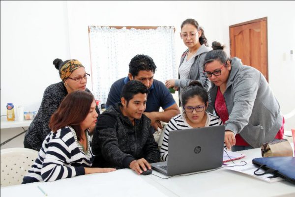 Jenny (right), Silvana (top) and other missionaries attend a literacy workshop