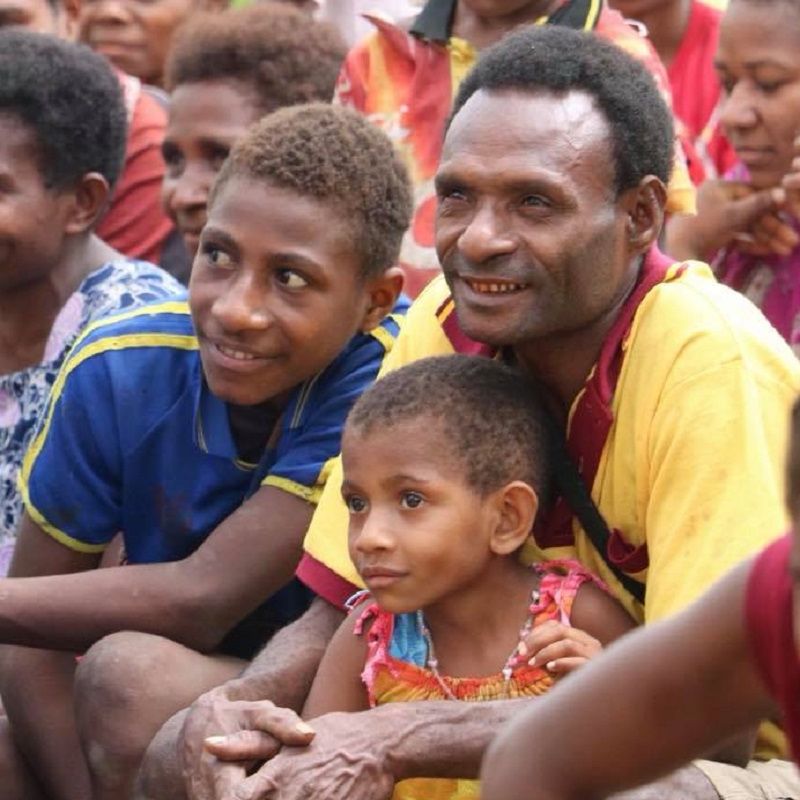 Kaje believers listening to Bible teaching