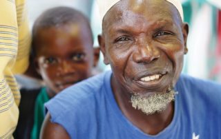 Tanzanian man and boy smiling