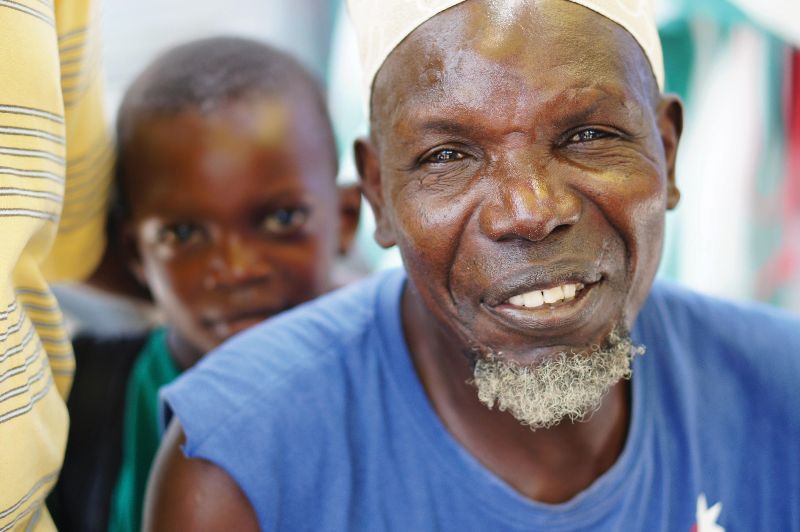 Tanzanian man and boy smiling