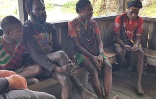 Wano people sitting on a porch in Asia-Pacific region