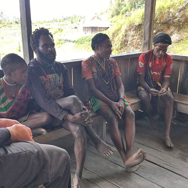 Wano people sitting on a porch in Asia-Pacific region