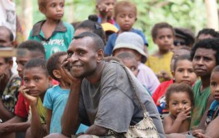 Kaje man smiling while at Bible teaching