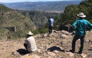 Nahuatl men looking at the mountainous horizon