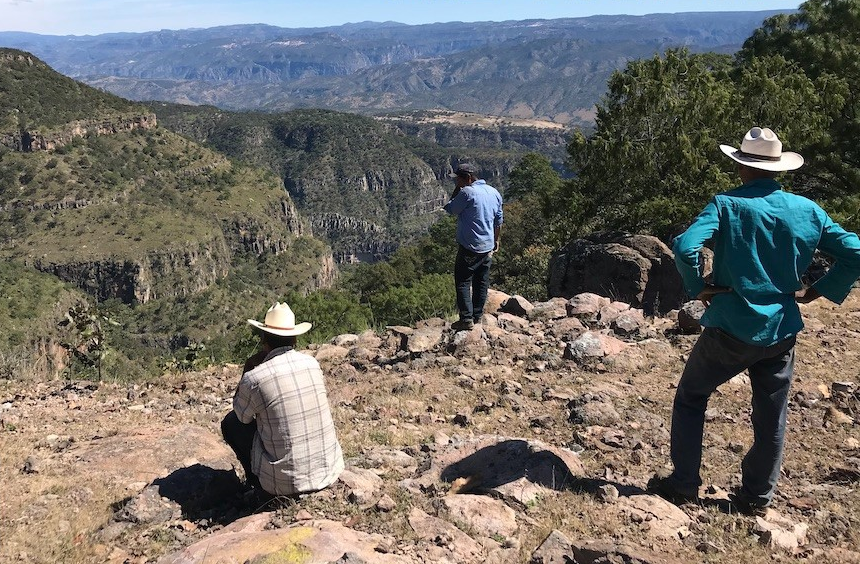 Nahuatl men looking at the mountainous horizon