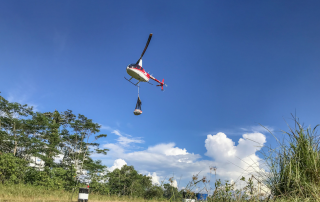 helicopter carrying sling-loaded goods