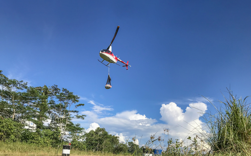 helicopter carrying sling-loaded goods