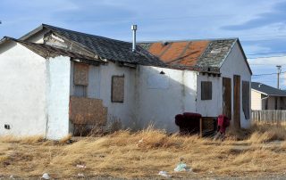 run down house to show an example of poverty