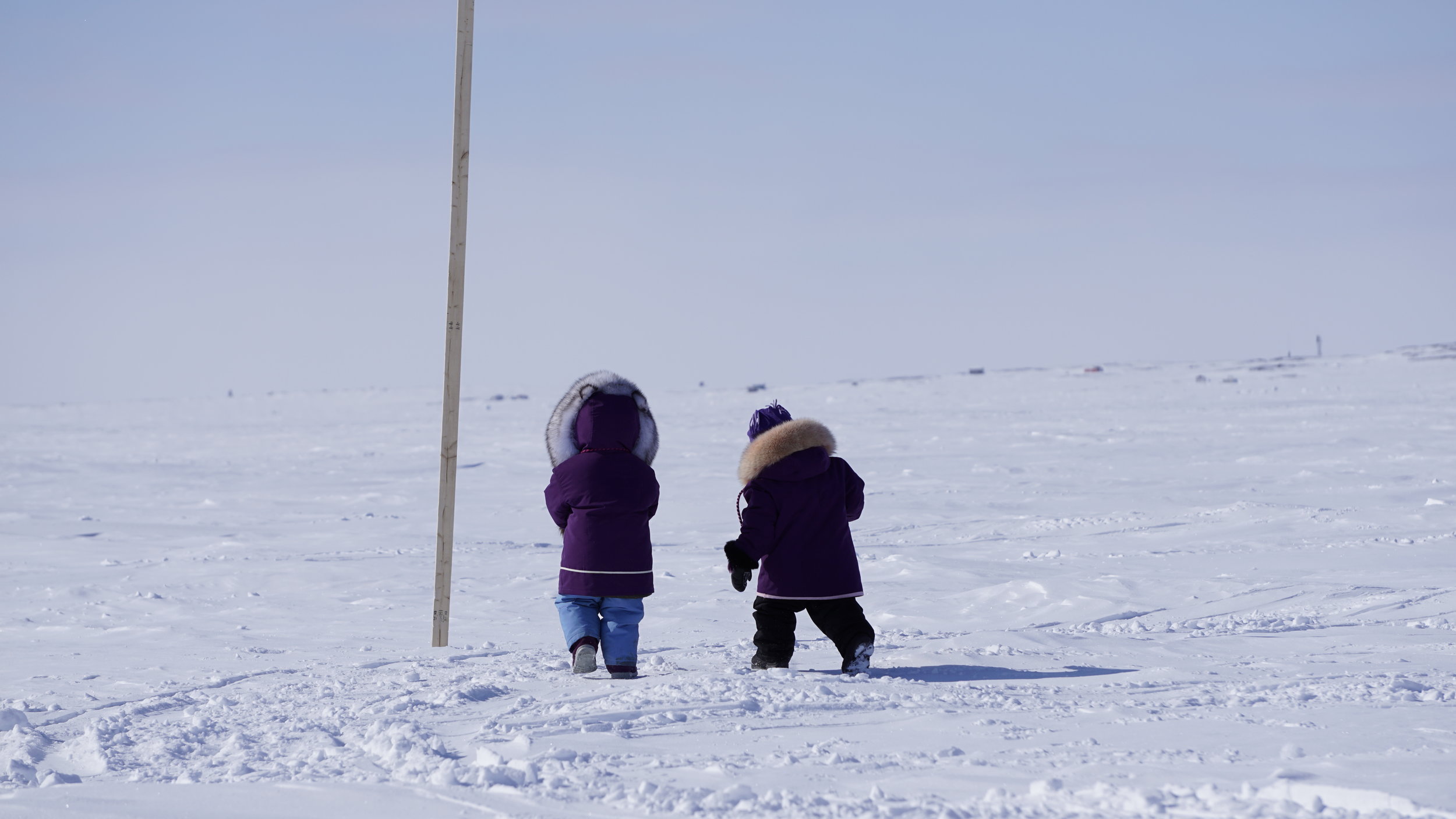 two kids walking outside in the far north