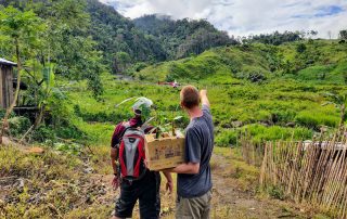 Grant Bayfield with a Filipino business man discussing bamboo growth