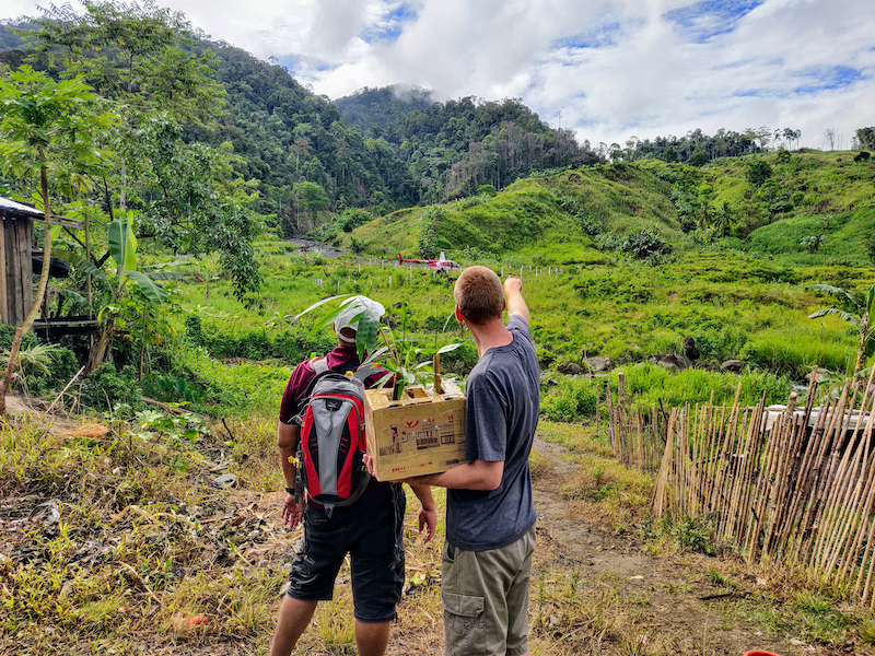 Grant Bayfield with a Filipino business man discussing bamboo growth