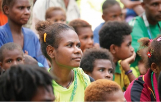 pre-COVID photo of Papua New Guinea people gathered to hear Bible teaching