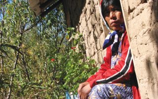 Tepehuan woman sitting in a door-frame