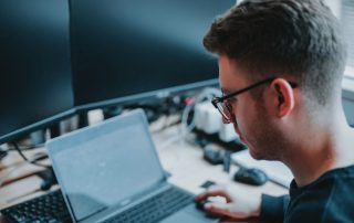 man working with computers