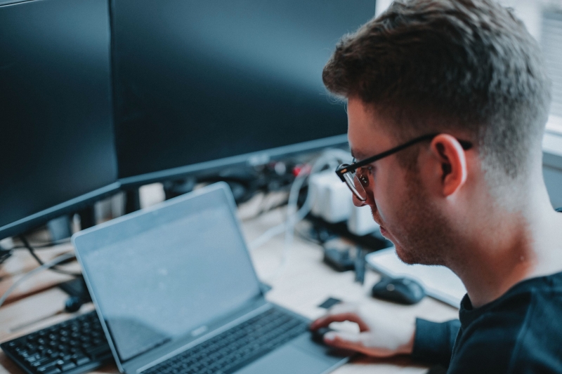 man working with computers