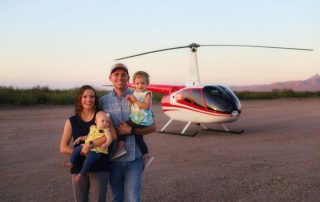 de Roos family in front of a helicopter